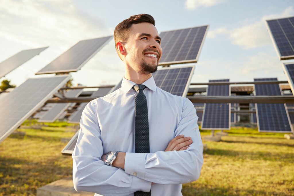 Confident businessman on solar power station